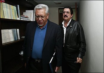 Honduras' ousted President Manuel Zelaya, right, walks next to Victor Meza, a Zelaya's representative and Minister of Interior of his government, after a meeting with other representatives at the Brazilian embassy in Tegucigalpa, Thursday, Oct. 29, 2009. (AP Photo/Esteban Felix)